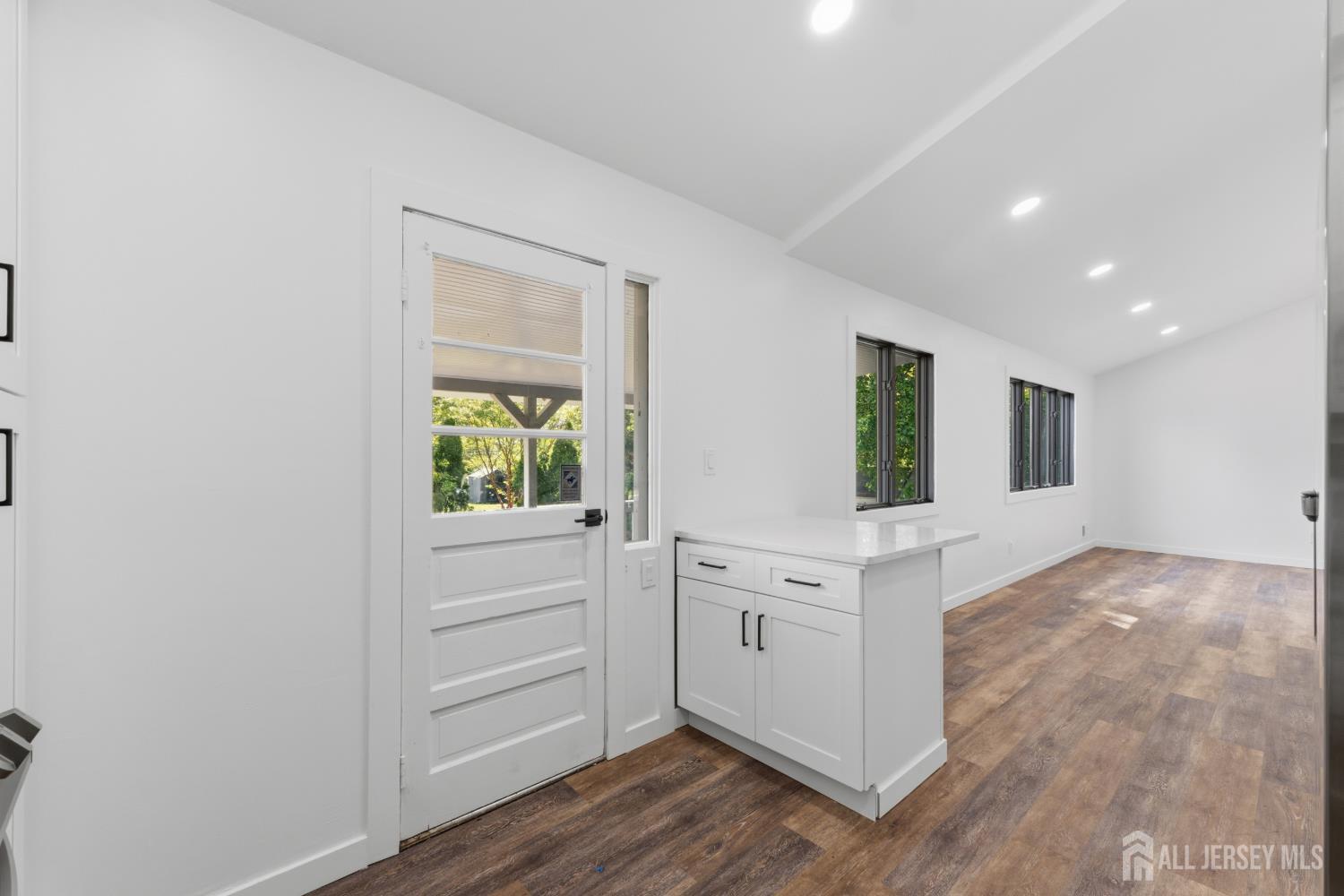 12 Daniel Road Spotswood, NJ 08884 - Photo 8 of 27 a view of kitchen with wooden floor and window