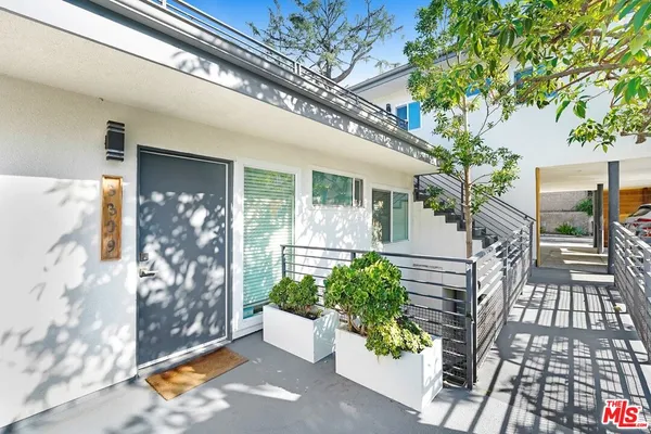 a front view of a house with outdoor space