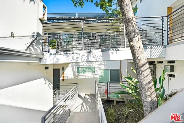 a view of a balcony with chairs