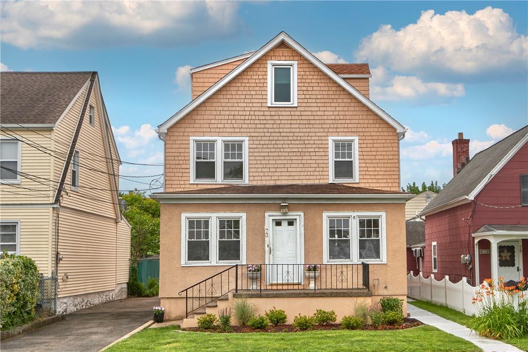 73 Congress Street Harrison, NY 10528 - Photo 1 of 1 a front view of a house with a yard