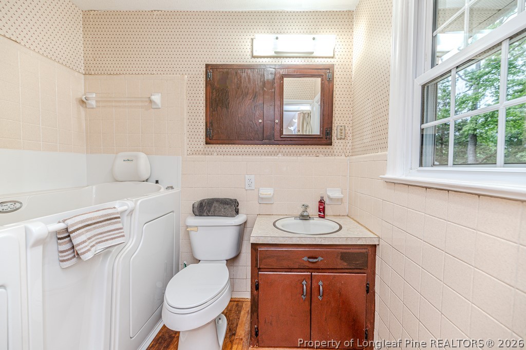 3384 Goldston Glendon Road Goldston, NC 27252 - Photo 20 of 47 a bathroom with a toilet sink and mirror