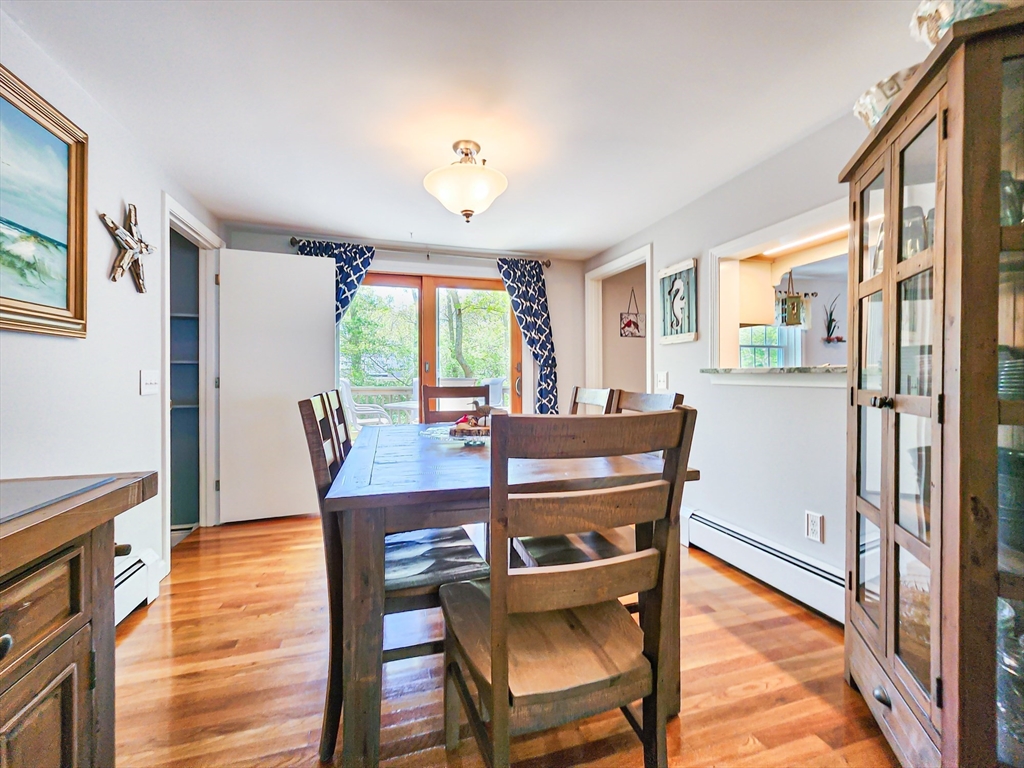 29 Sullivan Road Yarmouth, MA 02673 - Photo 11 of 42 a view of a dining room with furniture window and wooden floor