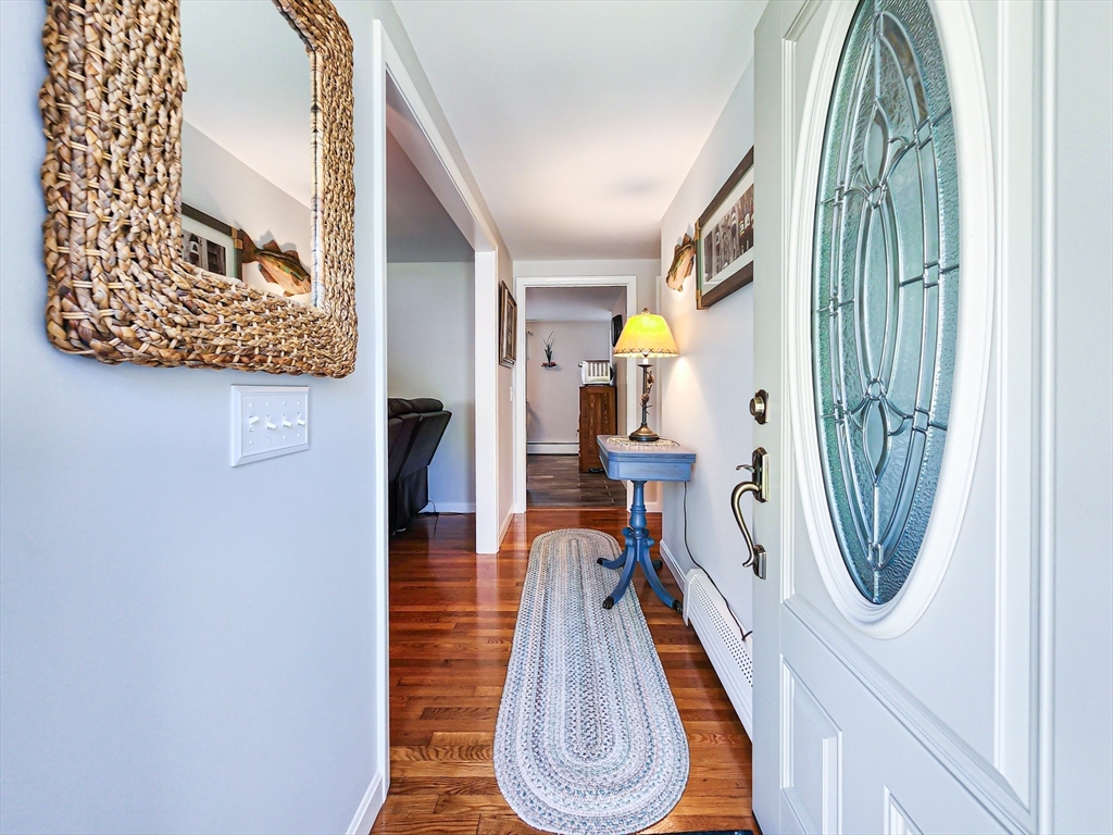 29 Sullivan Road Yarmouth, MA 02673 - Photo 2 of 42 a view of a hallway with wooden floor and entryway