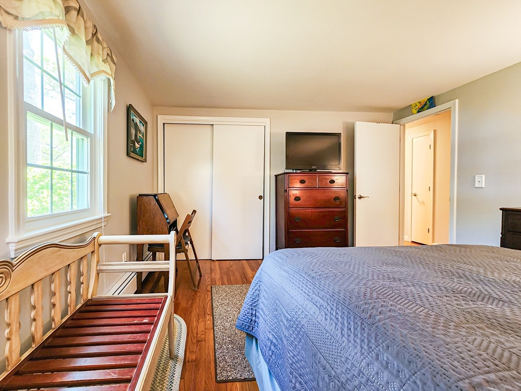 29 Sullivan Road Yarmouth, MA 02673 - Photo 21 of 42 a bedroom with furniture and a flat screen tv