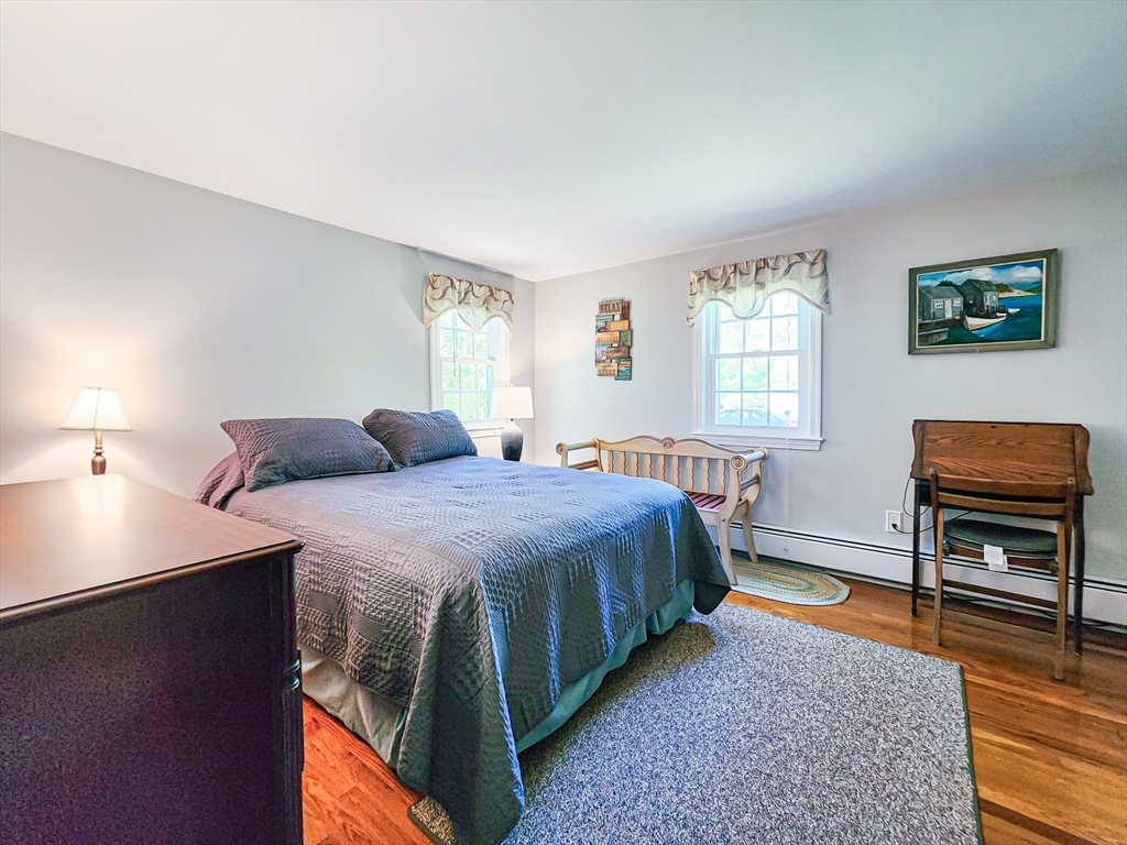 29 Sullivan Road Yarmouth, MA 02673 - Photo 22 of 42 a bedroom with a bed and window