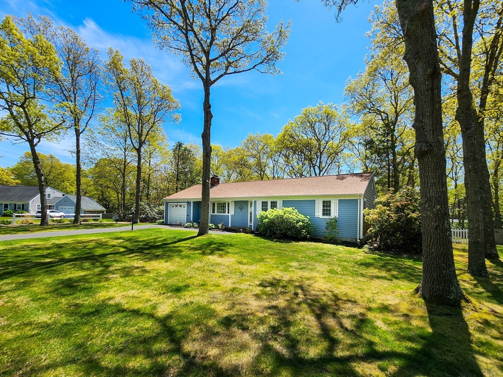 29 Sullivan Road Yarmouth, MA 02673 - Photo 25 of 42 a view of a house with a yard
