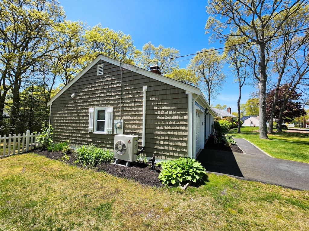 29 Sullivan Road Yarmouth, MA 02673 - Photo 27 of 42 a front view of a house with a yard