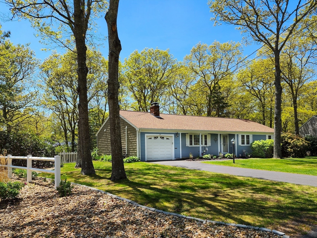 29 Sullivan Road Yarmouth, MA 02673 - Photo 28 of 42 a view of a house with a yard