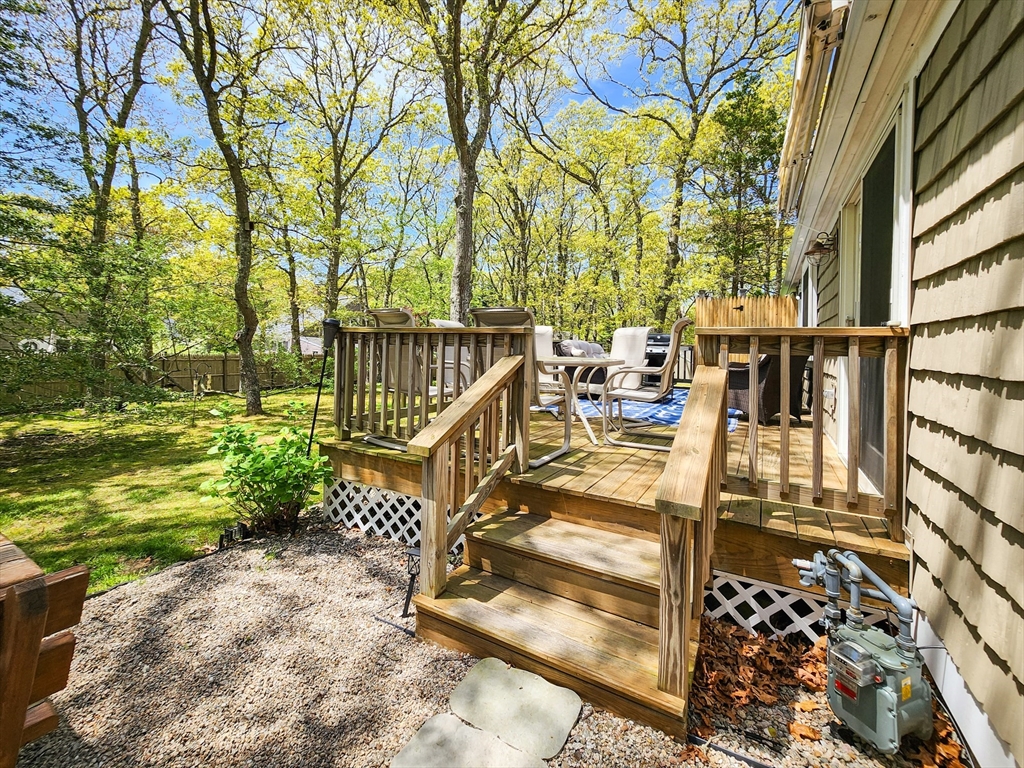 29 Sullivan Road Yarmouth, MA 02673 - Photo 31 of 42 a view of a balcony with floor to ceiling windows and wooden fence