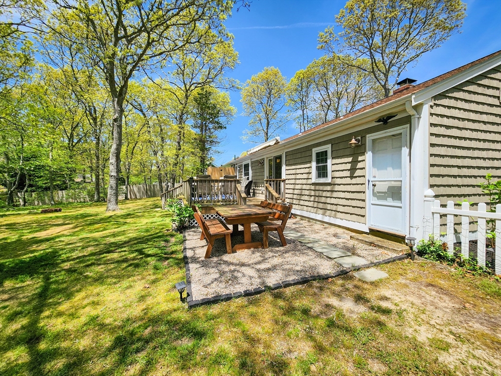 29 Sullivan Road Yarmouth, MA 02673 - Photo 32 of 42 a view of a house with backyard and sitting area