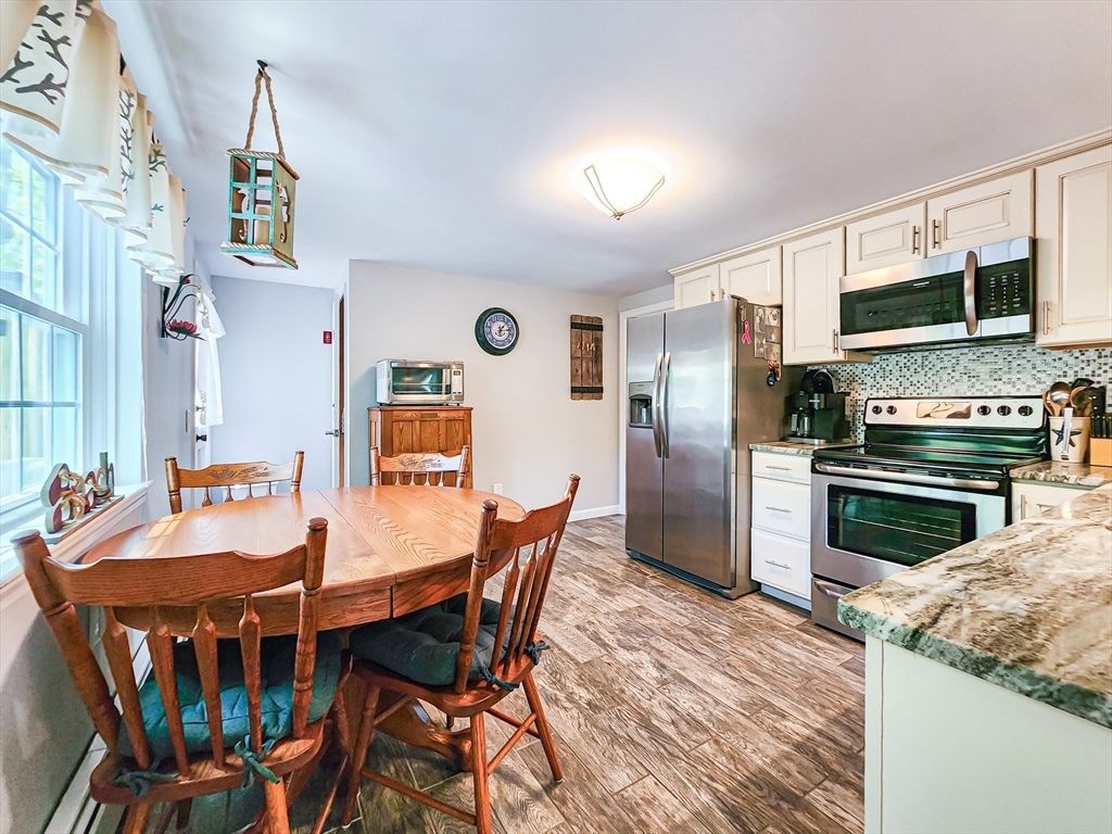 29 Sullivan Road Yarmouth, MA 02673 - Photo 8 of 42 a view of a dining room with furniture