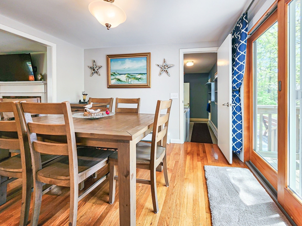29 Sullivan Road Yarmouth, MA 02673 - Photo 9 of 42 a view of a dining room with furniture and wooden floor