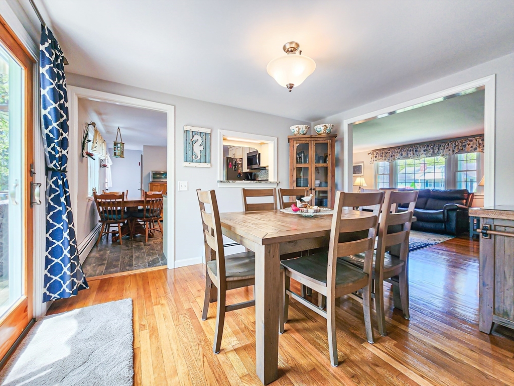 29 Sullivan Road Yarmouth, MA 02673 - Photo 10 of 42 a view of a dining room with furniture and wooden floor
