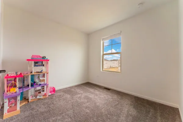 a view of storage and utility room with a window