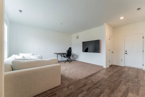 a living room with furniture and a window