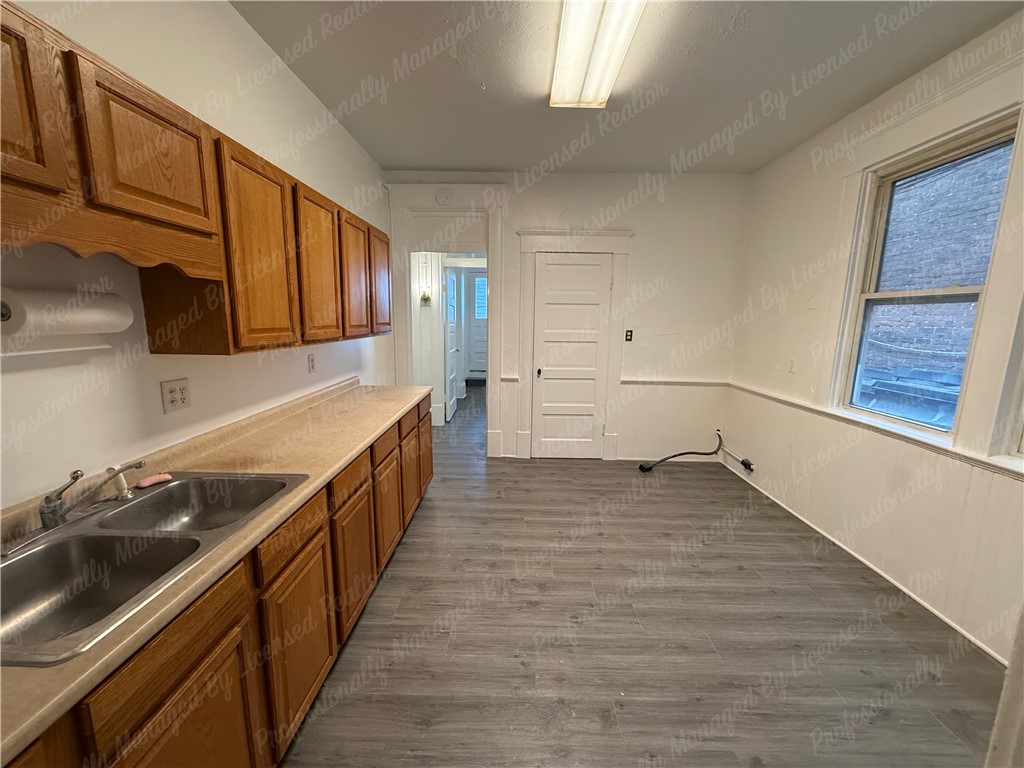 44 West High Street, Unit B Springfield, OH 45502 - Photo 22 of 31 This spacious kitchen offers ample cabinet storage and an abundance of natural light.