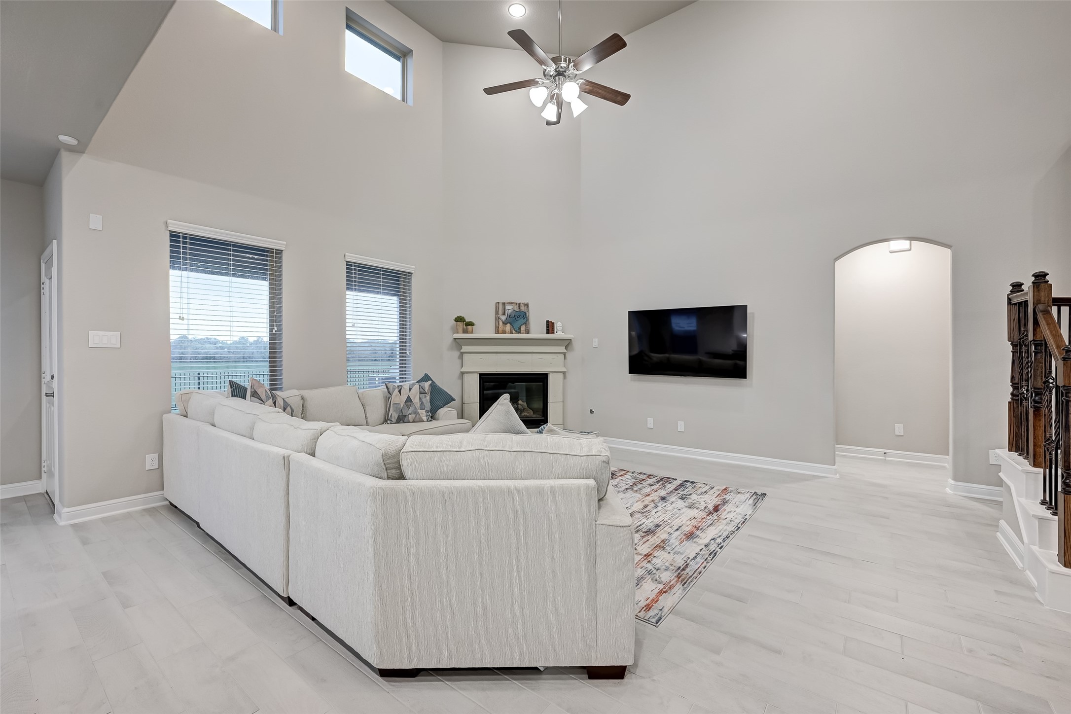 3327 Learning Tree Lane Rosenberg, TX 77471 - Photo 13 of 50 Relax in this gorgeous family room with high ceilings and Cast Stone fireplace.