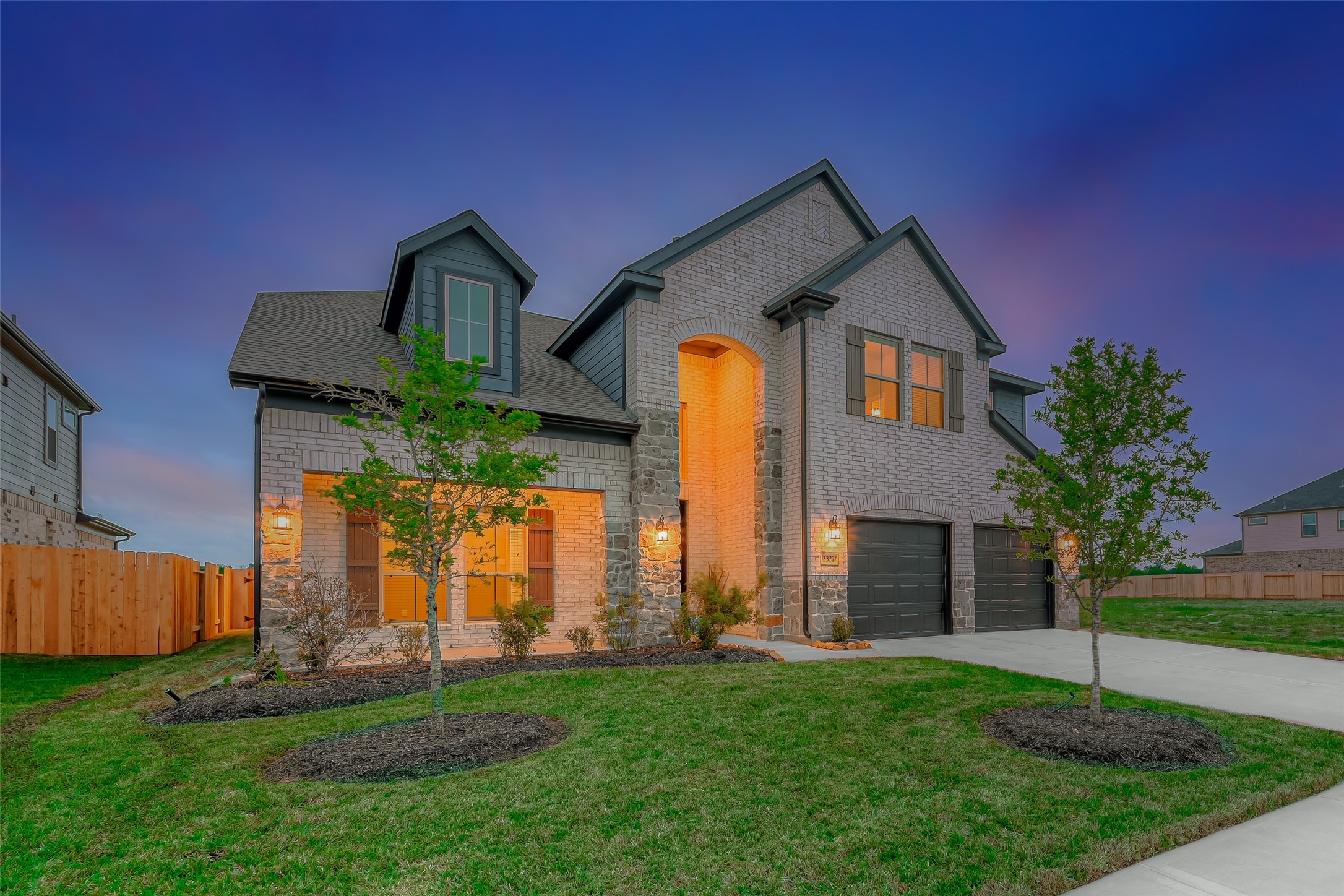 3327 Learning Tree Lane Rosenberg, TX 77471 - Photo 2 of 50 Beautiful brick and stone elevation with sleek landscaping