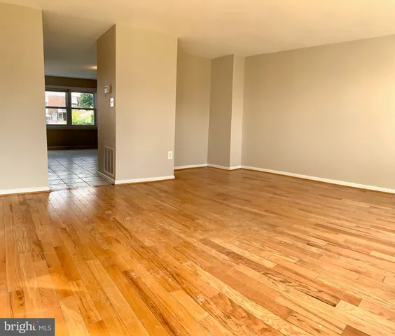 a view of an empty room and a window