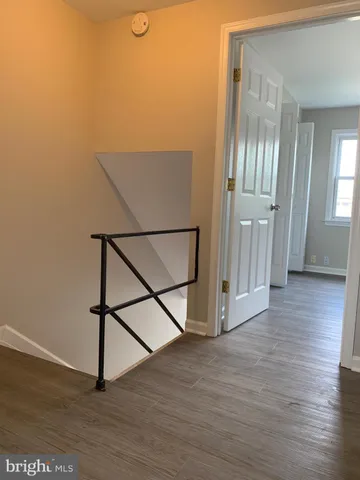 a view of entryway with wooden floor