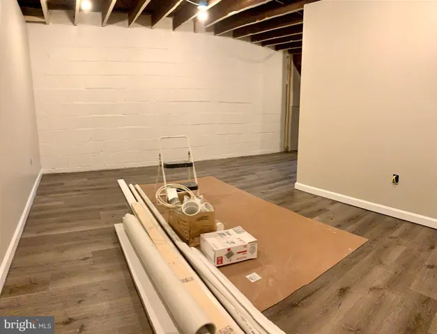 view of a room with wooden floor