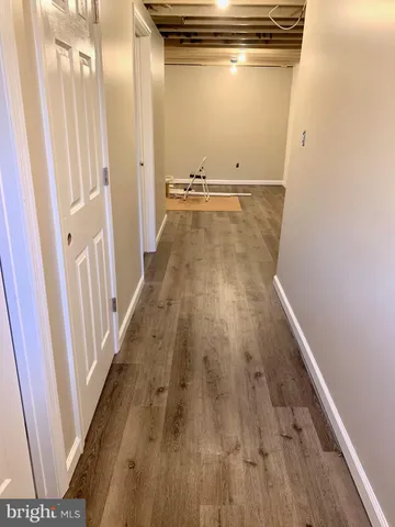 a view of a hardwood & staircase in a kitchen