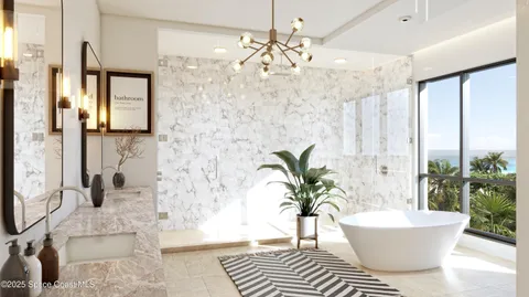 a spacious bedroom with a bed and a chandelier