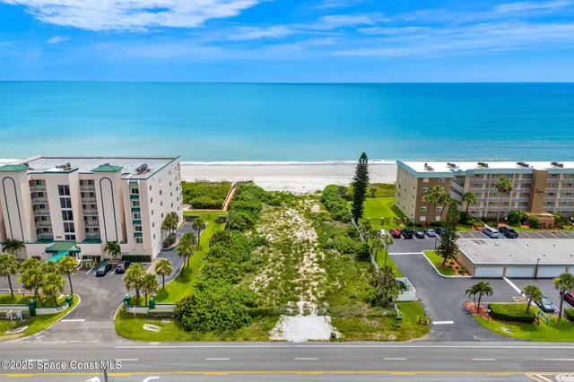 a view of swimming pool with outdoor seating and plants