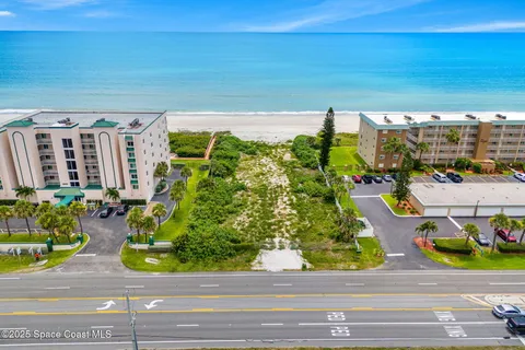 a view of swimming pool with outdoor seating and plants