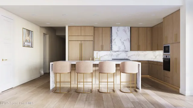 a living room with couches a dining table chairs and kitchen view