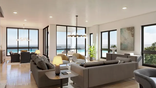 a living room with furniture and large windows