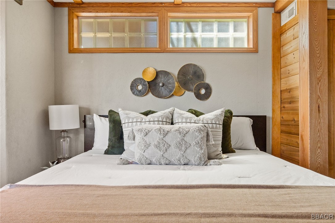 28971 Banff Drive Lake Arrowhead, CA 92352 - Photo 14 of 46 a large bed sitting in a bedroom next to a window