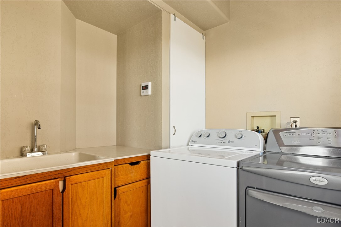 28971 Banff Drive Lake Arrowhead, CA 92352 - Photo 22 of 46 a utility room with dryer and washer
