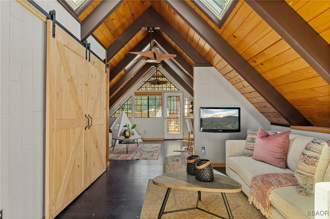 28971 Banff Drive Lake Arrowhead, CA 92352 - Photo 29 of 46 a living room with furniture and a flat screen tv