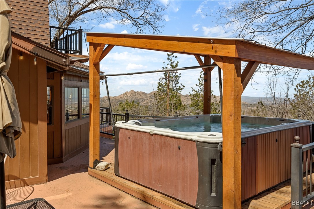 28971 Banff Drive Lake Arrowhead, CA 92352 - Photo 34 of 46 a view of a room with a large window and wooden floor