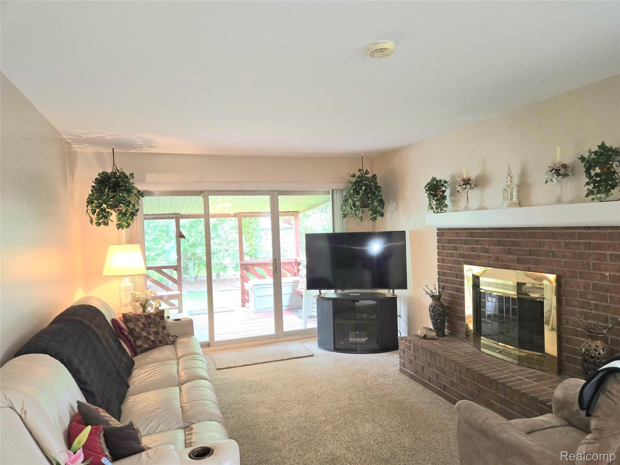 14879 Riverside Drive Livonia, MI 48154 - Photo 13 of 42 Family room with a fireplace