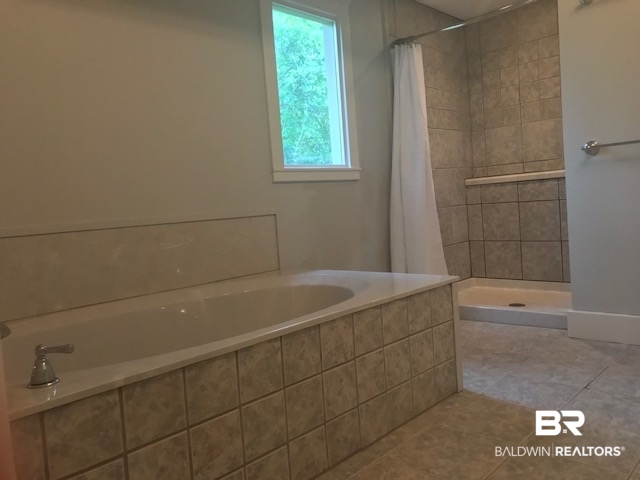 23481 Swift Church Road Elberta, AL 36530 - Photo 16 of 49 Large soaker Tub and spacious tiled shower