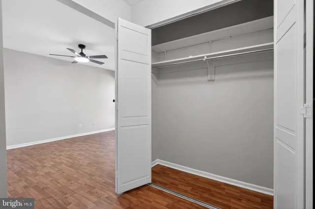 a view of room with a ceiling fan