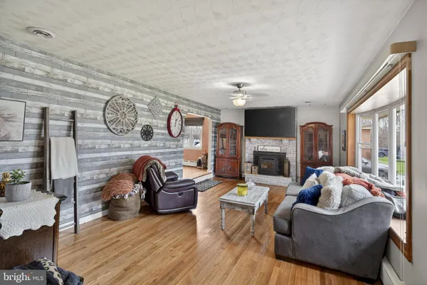 a kitchen with stainless steel appliances granite countertop a stove and a microwave with cabinets