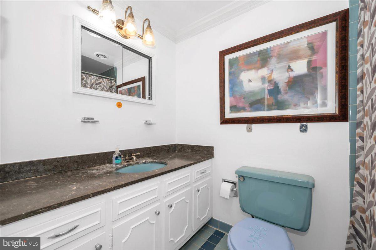 9701 Fields Road, Unit 2206 Gaithersburg, MD 20878 - Photo 15 of 30 a bathroom with a granite countertop sink mirror and vanity