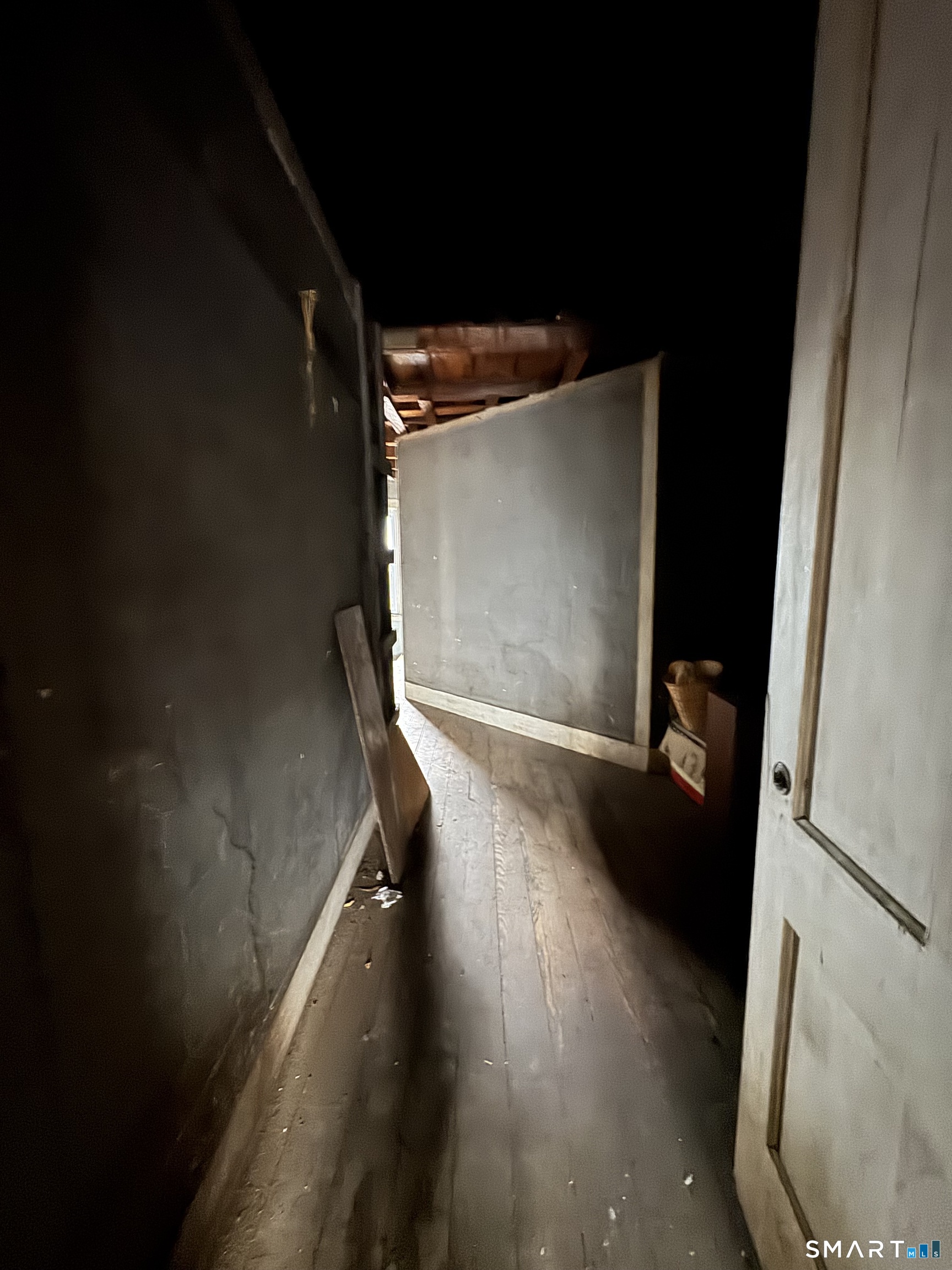 6 Williams Street New London, CT 06320 - Photo 12 of 23 a view of an empty room with wooden floor and a window