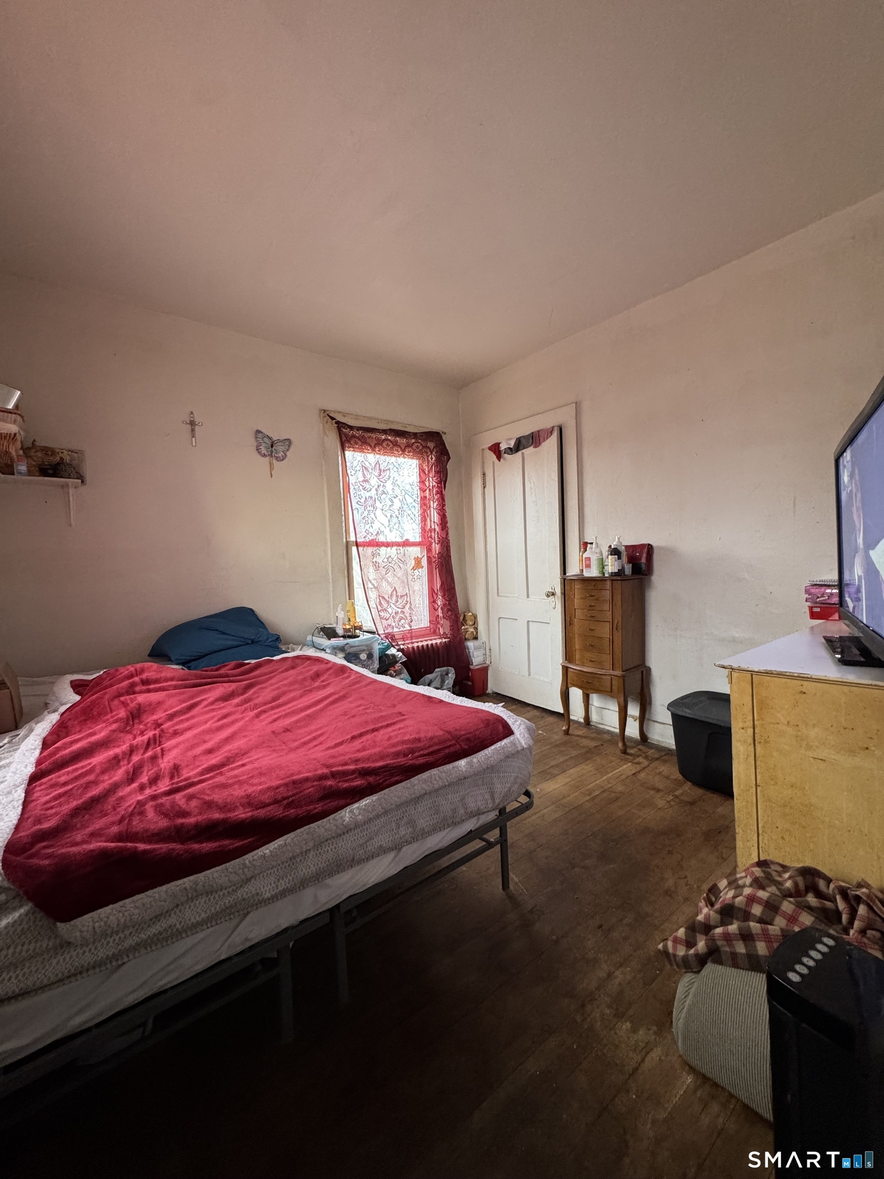 6 Williams Street New London, CT 06320 - Photo 15 of 23 a bedroom with a bed and a closet