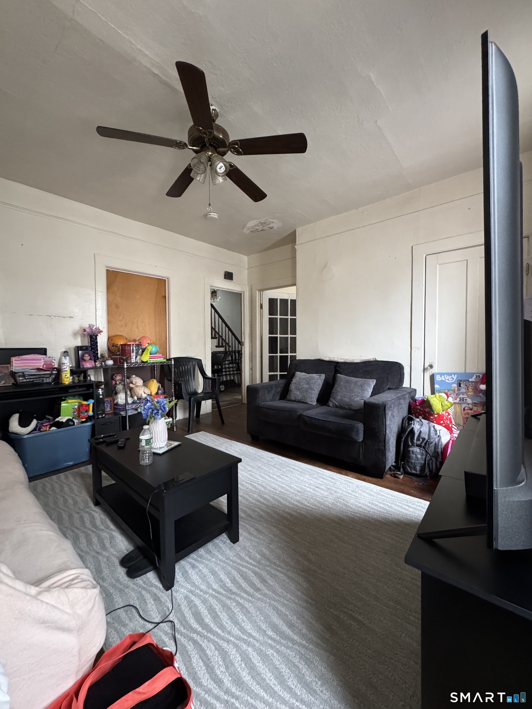 6 Williams Street New London, CT 06320 - Photo 16 of 23 a living room with furniture and a ceiling fan