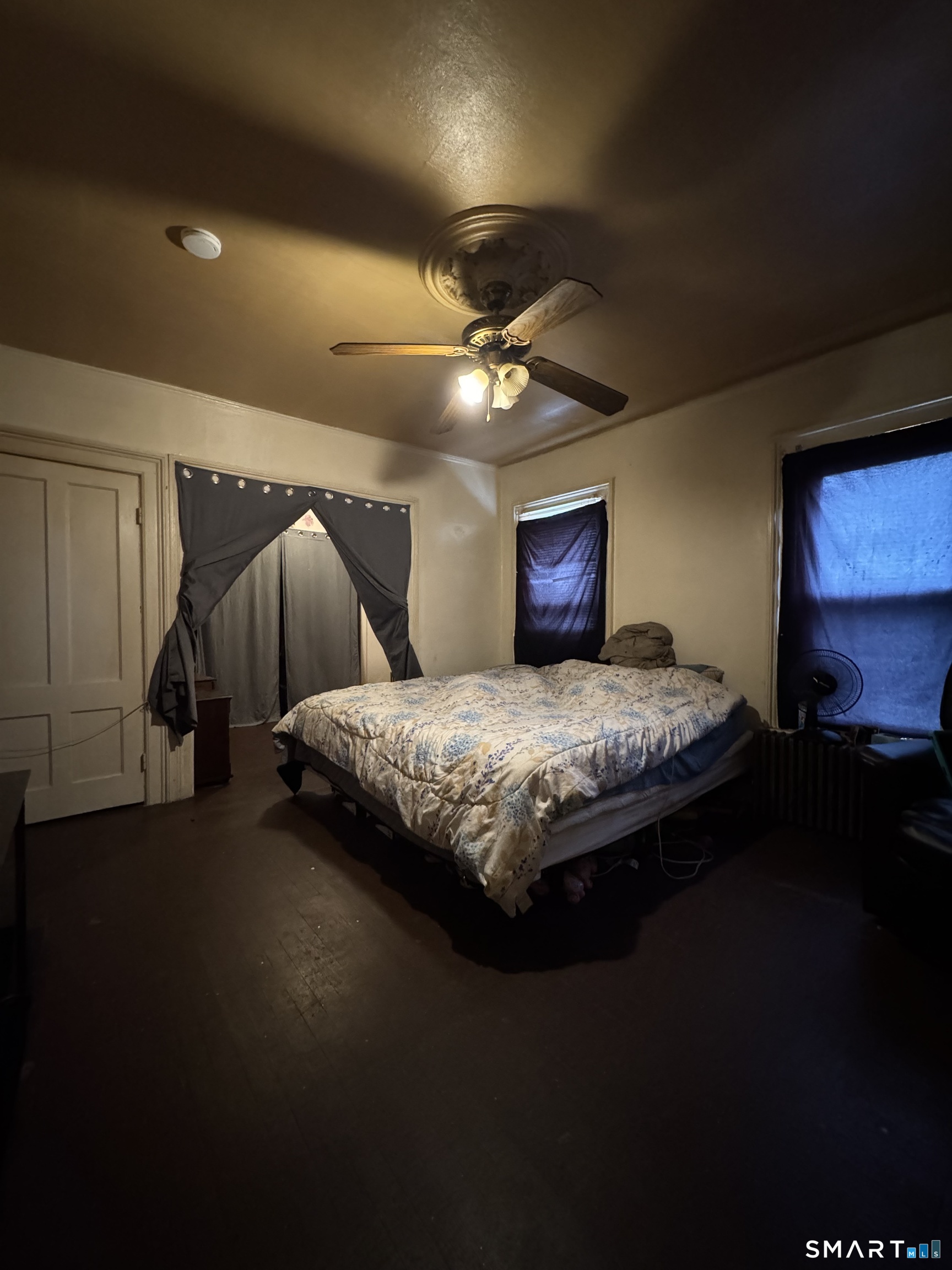 6 Williams Street New London, CT 06320 - Photo 16 of 23 a bedroom with a bed and a chandelier