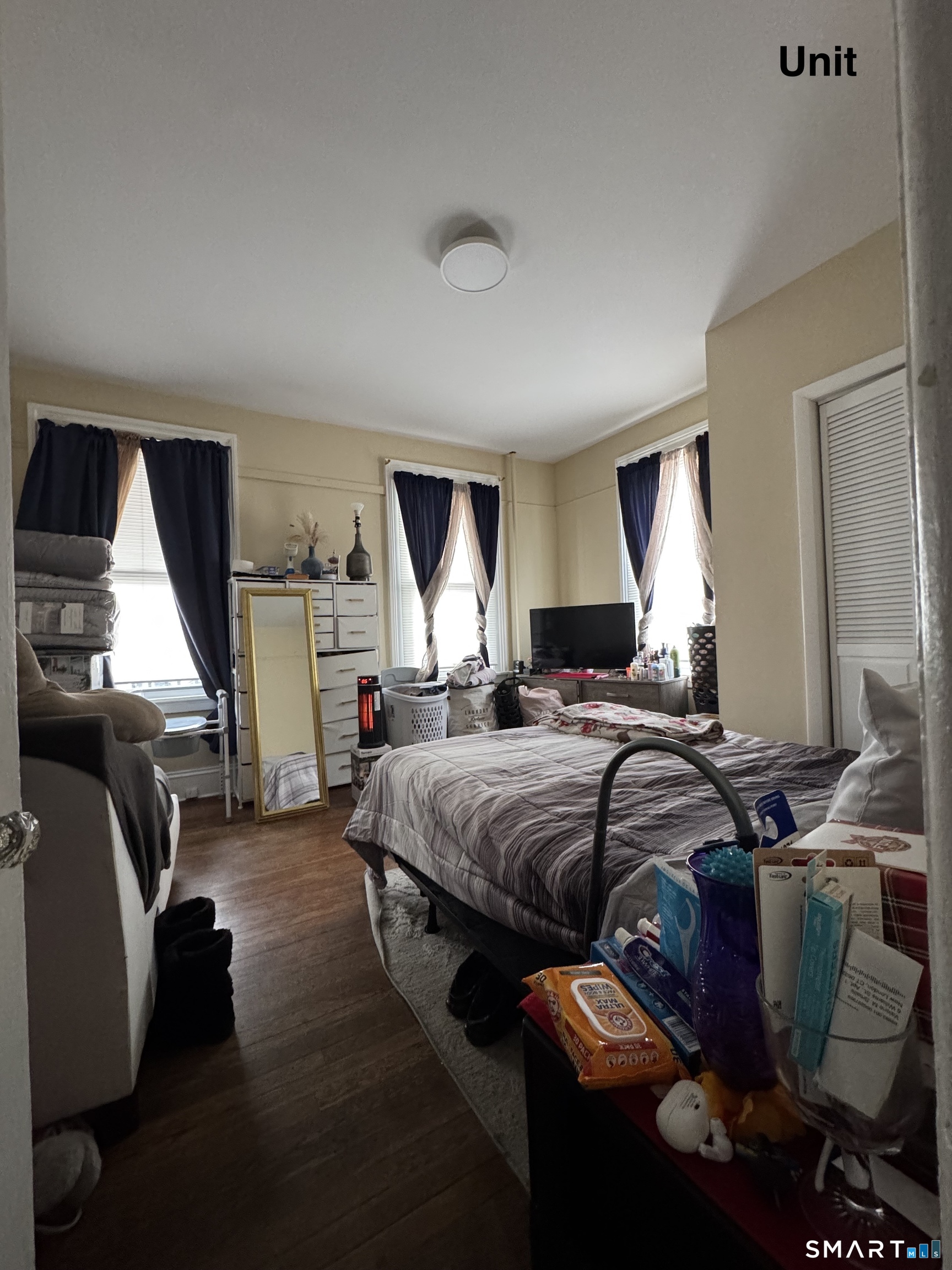 6 Williams Street New London, CT 06320 - Photo 2 of 23 a bedroom with bed and window