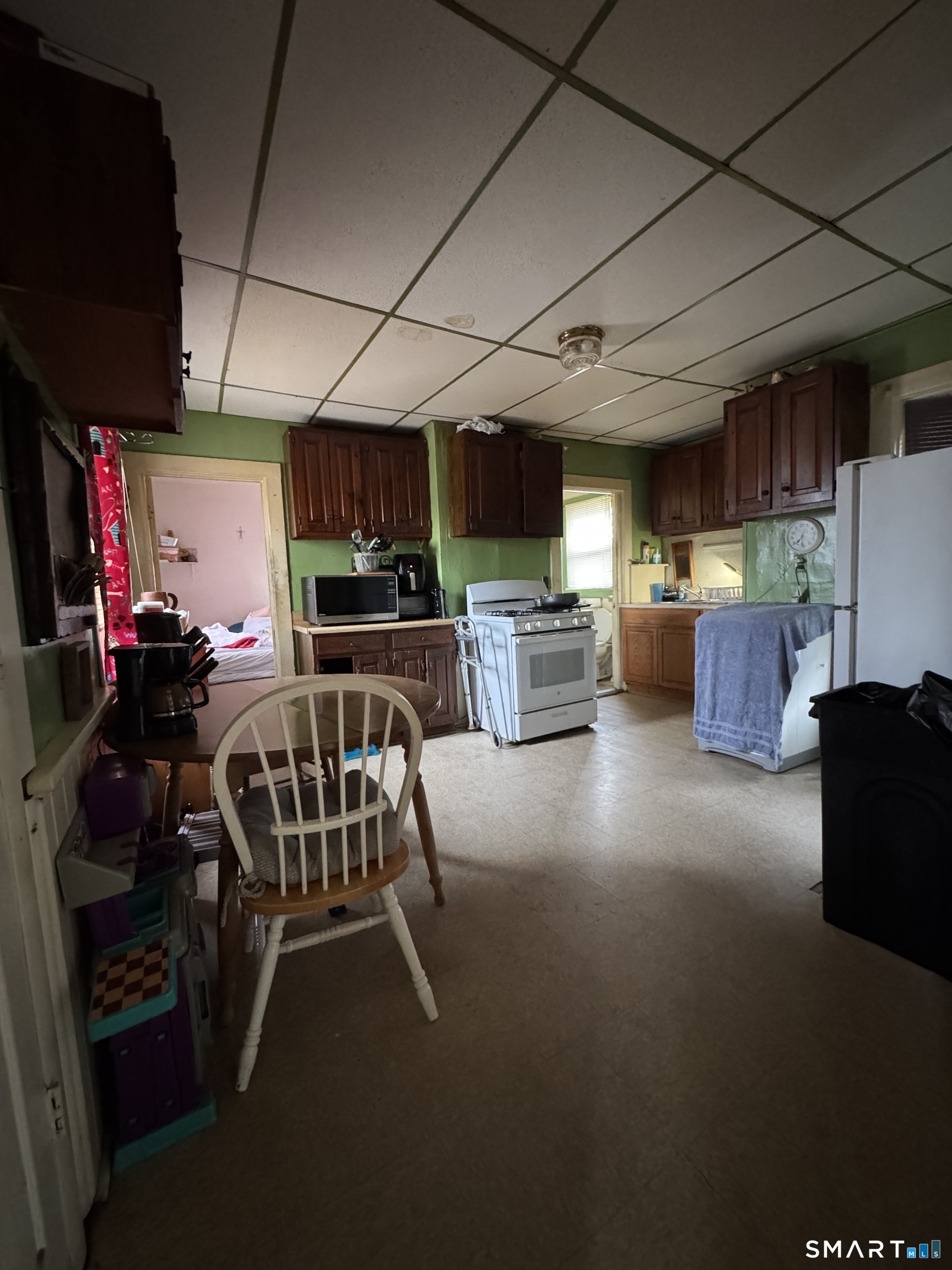 6 Williams Street New London, CT 06320 - Photo 5 of 23 a kitchen with furniture and a flat screen tv