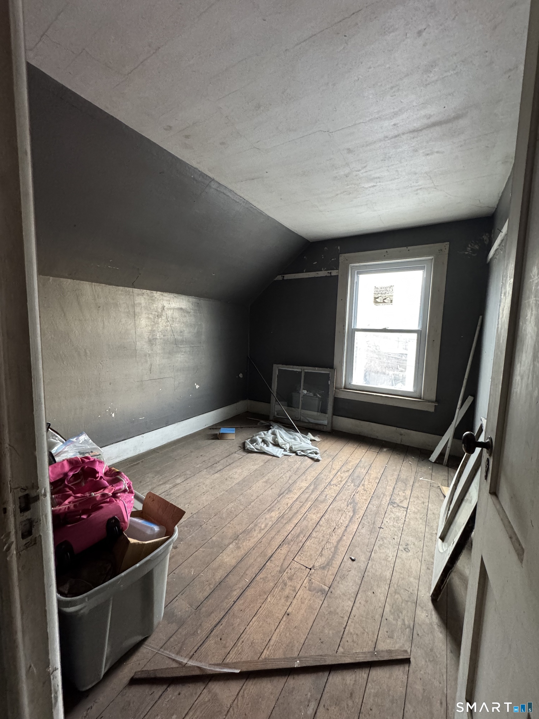 6 Williams Street New London, CT 06320 - Photo 10 of 23 a bedroom with a bed and a window