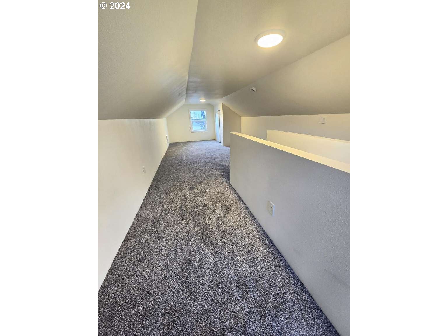 1223 C Street Springfield, OR 97477 - Photo 25 of 36 a view of a hallway with an empty room