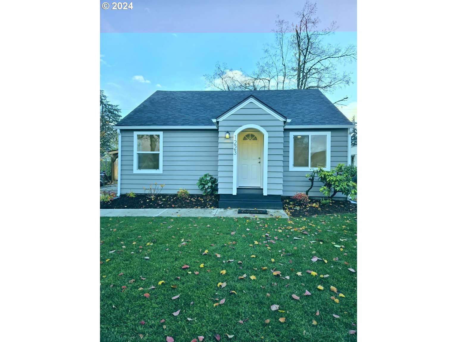 1223 C Street Springfield, OR 97477 - Photo 29 of 36 a front view of a house with a yard