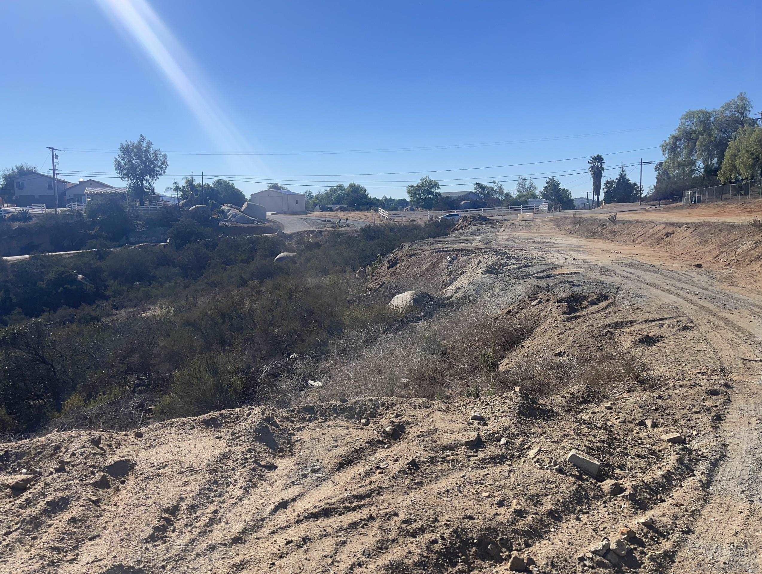 0 Miller Road Valley Center, CA 92082 - Photo 13 of 19 a view of a dry yard with wooden fence and mountain